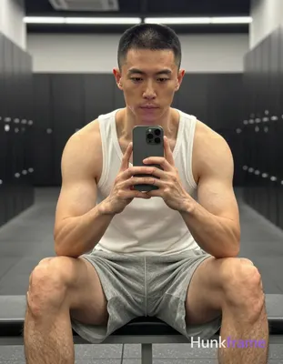 Photograph of exactly 1 adult man. Man 1: East Asian, light-medium, square-jawed
