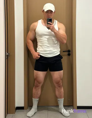 Full-body mirror selfie of a big hairy stocky man with light-medium skin and short dark hair under a