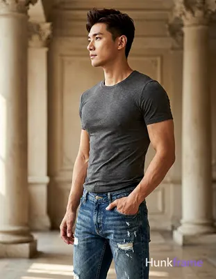 A handsome adult man with light-medium skin and dark brown/black short hair styl