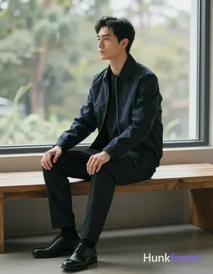 Asian man with fair skin and black short hair styled back with volume at crown, 