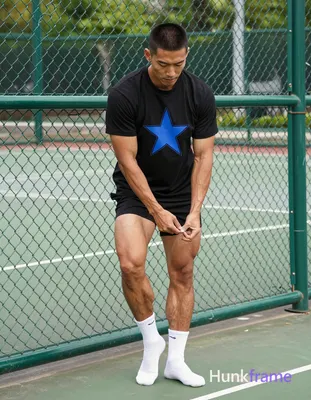 an anonymous figure man with light to medium tan skin and short black buzz cut stands near a green c
