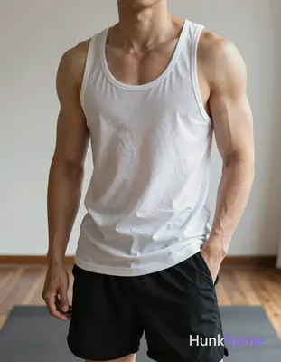 Vertical fashion editorial portrait of an adult man with a highly muscular build