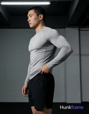 an anonymous figure man with short black buzz cut and textured top standing in p