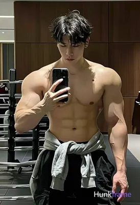 Photograph of exactly 1 adult man. Man 1: Asian, light tan, oval with defined jawline, short dark ha