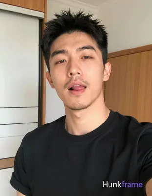an anonymous figure man with short black hair and upward texture, sparse mustache and chin stubble,