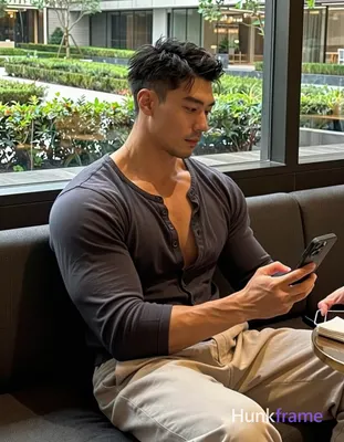 Photograph of exactly 1 adult man. Man 1: Asian, medium-tan, square-jawed with d