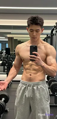 Asian man with short dark textured hair and clean-shaven face, light-medium skin
