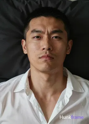 Photograph of exactly 1 adult man. Man 1: East Asian, light to medium tan with n