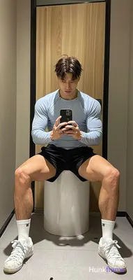 Asian man with light to medium tan skin and short dark brown hair featuring textured top, faded side