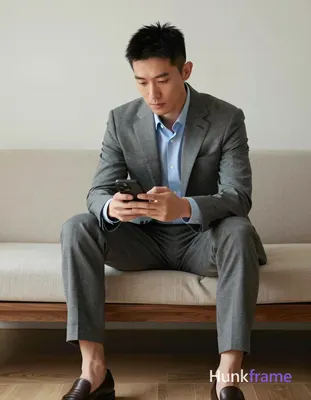 Photograph of exactly 1 adult man. Man 1: Asian, light-medium, square-jawed with