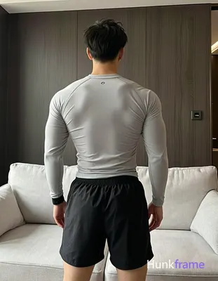Adult man with short dark black straight hair and clean-shaven neck, back fully 