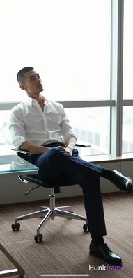 an anonymous figure man in his 30s with a short black buzz cut and clean-shaven 