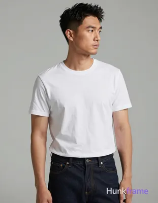 Asian man with light-medium skin and short dark black hair featuring a textured top swept upward, fa