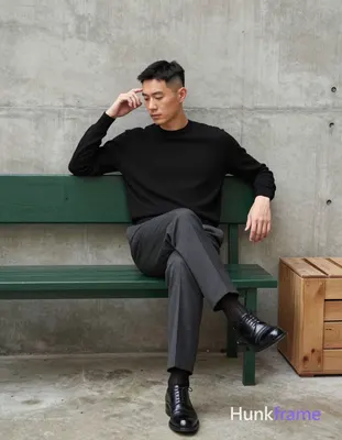Asian man in premium fashion editorial, seated full-body shot against textured c