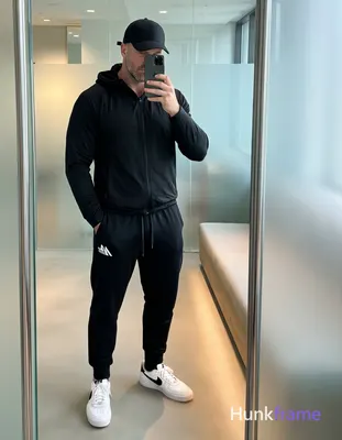 Full-body vertical mirror selfie of a handsome adult man with light to medium sk