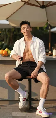 Asian man with light-medium skin and black short styled hair, clean-shaven face smiling at camera. S