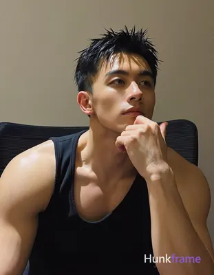 Asian man with medium-tan skin and short textured black hair, contemplative pensive gaze directed up