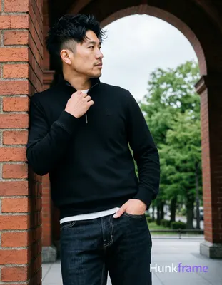 Asian man, light-medium skin, short textured black hair styled upward at the crown with tapered side