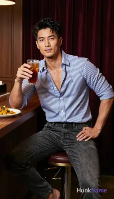 Asian man with medium-light skin, short dark black hair textured top and sides with tousled front ba