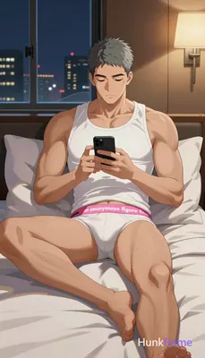 Asian man with ash-grey short textured crop cut and minor stubble shadow, reclining on bedroom bed a