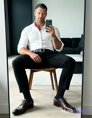 Full-body mirror selfie of an adult man with light-medium skin and short dark ha