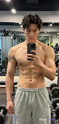 Photograph of exactly 1 adult man. Man 1: Asian, light to medium tan, oval with defined jawline, sho