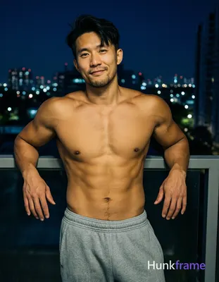 Asian man with light tan skin and short dark black hair styled upward at the crown with side-swept b