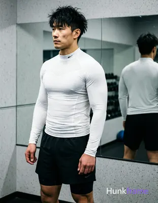 Asian man with short textured black hair styled upward at the crown, slightly messy front bangs fall