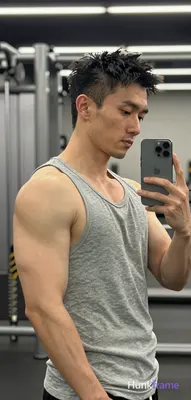 Photograph of exactly 1 adult man. Man 1: Asian, light-medium, square-jawed with defined cheekbones,