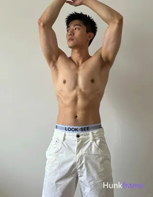 A photorealistic portrait of a shirtless Asian man standing with his arms raised