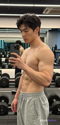 Photograph of exactly 1 adult man. Man 1: Asian, light to medium tan, oval with defined jawline, sho