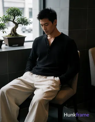 an anonymous figure man with medium tan skin and short spiky black hair, clean-shaven chin with fain