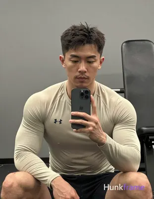 Photograph of exactly 1 adult man. Man 1: asian, light-medium, square-jawed with defined cheekbones,