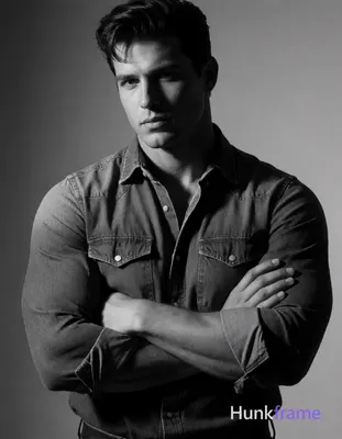 Heavily muscular adult man with substantial muscle mass, wide shoulders, thick n