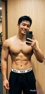 an anonymous figure fitness influencer with short black hair and clean-shaven fa