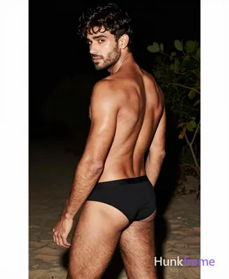 an anonymous figure man with light tan skin sheen, short dark brown tousled hair and side-swept bang