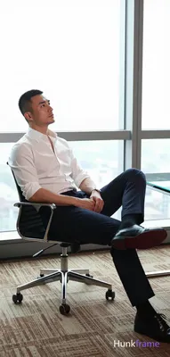 an anonymous figure man in his 30s with a short black buzz cut and clean-shaven 