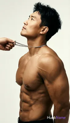 Asian man with light to medium tan skin and short textured black hair, clean-shaven face; Standing i