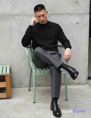 Asian man with short black undercut hair, clean-shaven face, neutral expression 