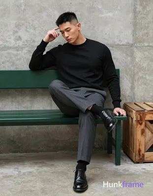Asian man in muscle bear photography, seated full-body shot against textured con
