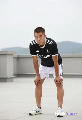 Asian man with short buzz cut and matte dark brown hair, clean-shaven face, neutral focused gaze. St