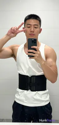 Asian man with short black buzz cut and clean-shaven face, light-medium skin ton