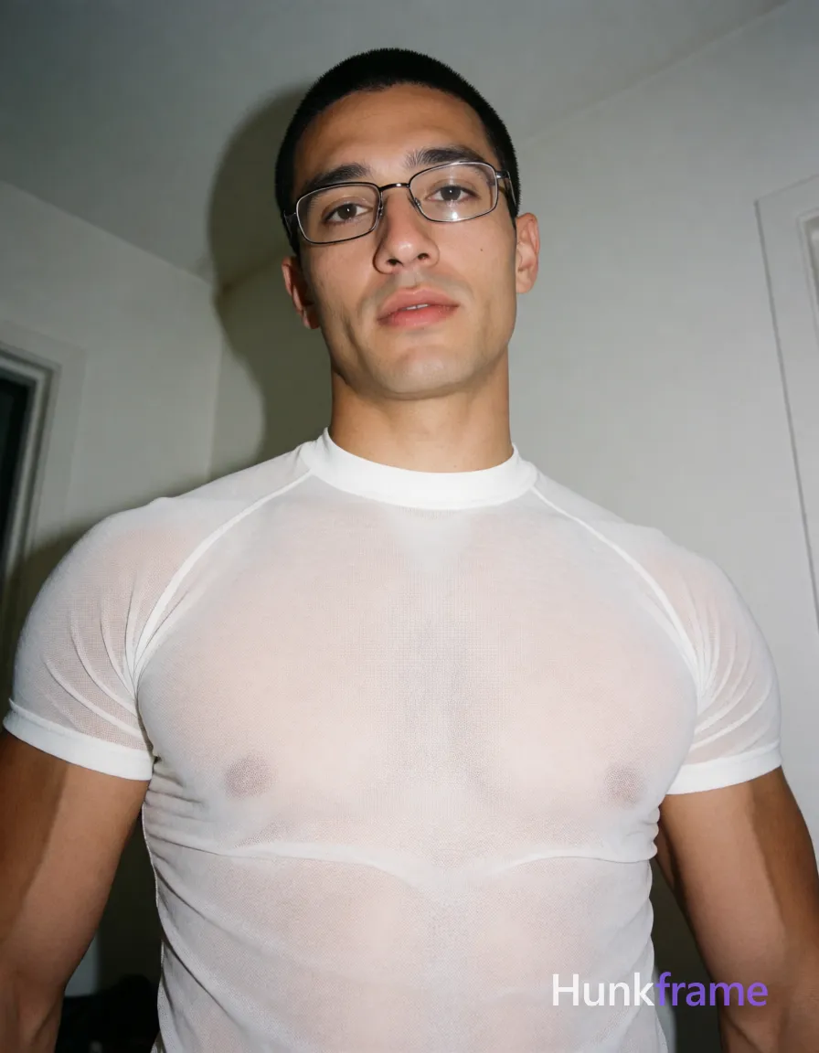 Heavily muscular adult man with substantial muscle mass, wide shoulders, thick neck, large chest and arms, powerful thighs, and dense bodybuilding proportions; an anonymous figure man with short black buzz cut and metal-framed rectangular glasses, clean-shaven chin with light upper lip stubble; Standing upright facing camera with slight head tilt, mouth slightly parted in neutral surprise; Wearing white sheer an anonymous figure compression shirt revealing broad shoulders, defined pectorals, and abdominal definition through the fabric; Indoor room corner setting with white walls; Low-angle selfie perspective, high-contrast flash photography creating harsh highlights on sweaty skin texture; Vertical portrait crop at waist level; The adult man visibly wears metal-framed rectangular glasses with thin rims, clear lenses; preserve the exact frame shape, rim style, color, material, and lens tint, same aesthetic theme and photo feel as the reference but a different man in a different pose with distinct body proportions, Turkish man, olive skin, aquiline nose, heavily muscular hairy chest editorial look; single clean uninterrupted photograph with a cohesive editorial composition and plain continuous surrounding surfaces