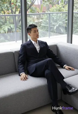 an anonymous figure man with short black straight hair and neat side parting, cl