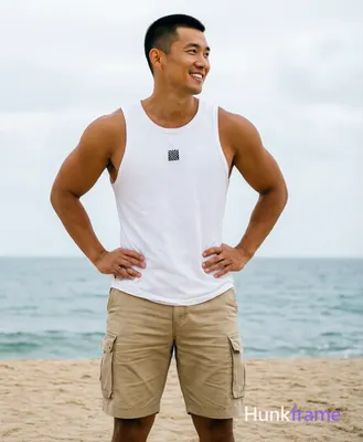 Asian man with light-medium tan skin and short black buzz cut, clean-shaven face smiling with confid