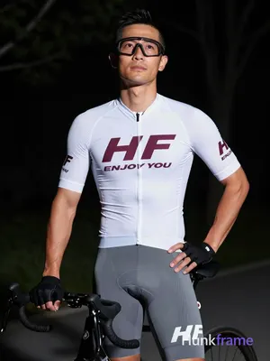 Asian man with light-medium skin and short black hair, clean-shaven sides, weari