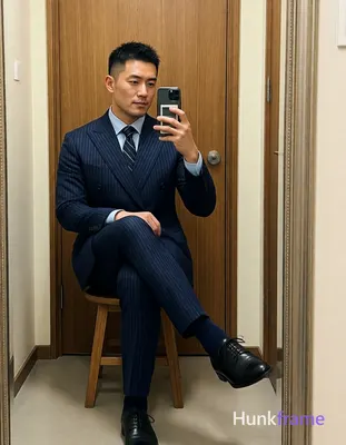 Asian man with light-medium skin and short textured dark crop hair, clean-shaven