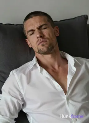 an anonymous figure adult man with short black buzz cut and light stubble, grima