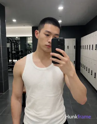 an anonymous figure man with short buzz cut and clean-shaven face, shirtless wea