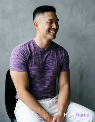 Asian man with short buzz cut black hair high and tight fade sides, clean-shaven